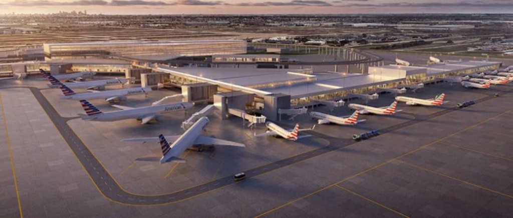 Airport terminal with multiple aircraft, representing infrastructure planning for electric aviation
